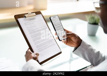 Taking Document Picture Using Phone Stock Photo