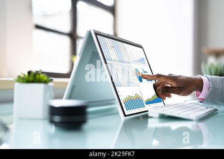 Analyst Employee Working On Spreadsheet Stock Photo