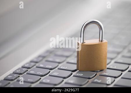 Security concept with metal padlock on computer keyboard Stock Photo
