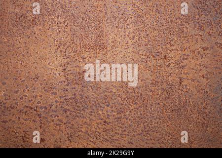 Rusty texture. Rough surface of oxidized metal. Rust hit the metal. Old metal tin sheet. Stock Photo