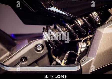 Close up of motorcycle shock absorber on back wheel Stock Photo