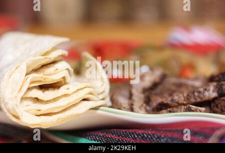Fresh Corn Tortillas on Plate With Fajita Dinner Stock Photo