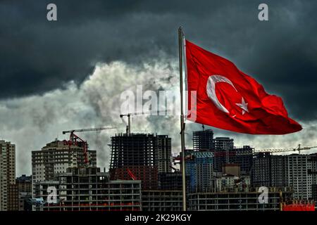 turkey turkish flag waving in front of construction site in istanbul dense population no nature dust clouds no sun Stock Photo