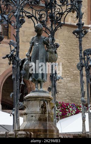 The GÃ¤nseliesel in GÃ¶ttingen is considered the most kissed woman in the world. It has stood on the old market square in front of the historic GÃ¶ttingen town hall since 1901. Stock Photo