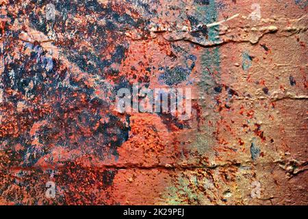 Texture of colorful graffiti paint on conrete and brick walls in red blue purple and silver Stock Photo