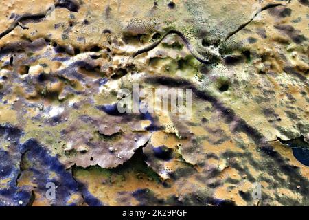 Texture of colorful graffiti paint on conrete and brick walls in red blue purple and silver Stock Photo