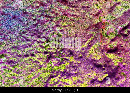 Texture of colorful graffiti paint on conrete and brick walls in red blue purple and silver Stock Photo
