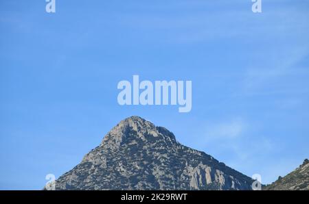 the moon, just before colliding with the mountain, Alicante province, Costa Blanca, Spain Stock Photo