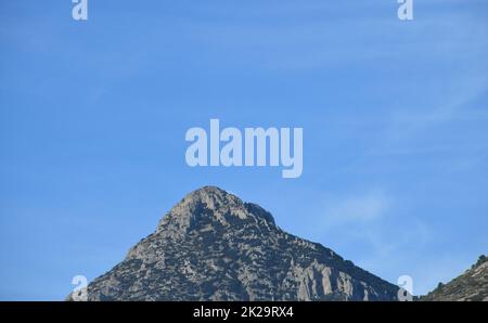 the moon, just before colliding with the mountain, Alicante province, Costa Blanca, Spain Stock Photo