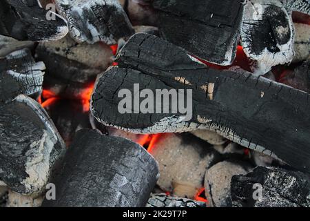 Hot orange burning coal on a barbecue grill. Stock Photo