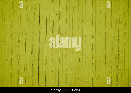 Old yellow weathered wooden wall with rustic planks Stock Photo
