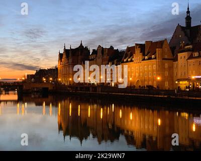 Dramatic picture of the historical buildings of Gdansk on the cold channel Stock Photo