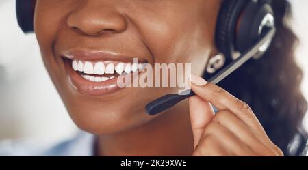 Call center agent, smile and black woman telemarketing operator or consultant talking on headset for customer service. Closeup mouth of happy female Stock Photo