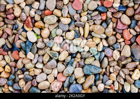 Smooth river rocks are used in landscaping, May 5, 2017, in Mobile, Alabama. River rocks help soil absorb water, prevent runoff, and prevent erosion. Stock Photo
