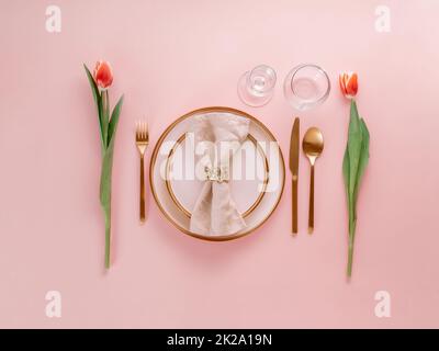 Table setting on pink background Stock Photo