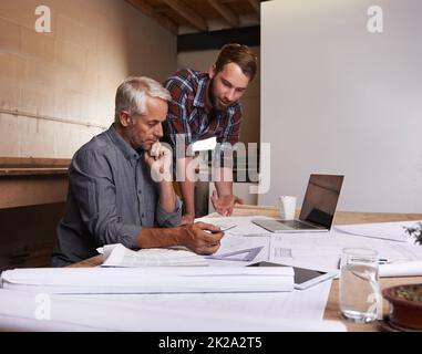 Turning his vision into reality. An architect drawing up plans. Stock Photo