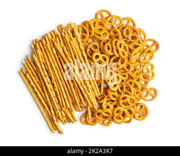 Mini pretzels and salted sticks. Crusty salted snack isolated on white background. Stock Photo