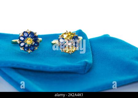 Blue and yellow sapphire Jewel or gems ring on velvet bag. Collection of natural gemstones accessories. Studio shot Stock Photo