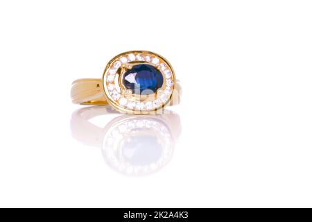 Ceylon Blue Sapphire and Diamond Jewel or gems ring on  white background with reflection. Collection of natural gemstones accessories. Studio shot Stock Photo