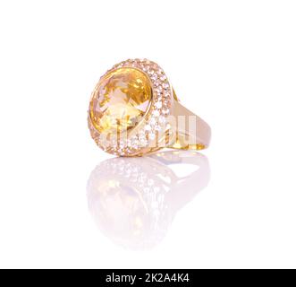 Citrine and Diamond Jewel or gems ring on white background with reflection. Collection of natural gemstones accessories. Studio shot Stock Photo