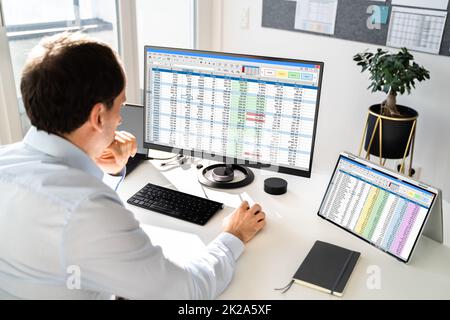 Analyst Working With Spreadsheet Business Data Stock Photo