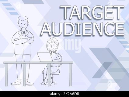 Writing displaying text Target Audience. Word for intended group of consumers most likely to be interested Man Standing Crossed Arms Watching Sitting Woman Using Laptop. Stock Photo