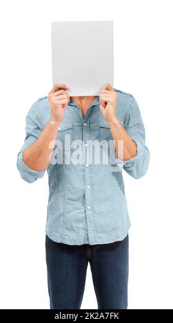 Please give me a personality. A male holding up a blank placard in front of his face - Copy space - Conceptual. Stock Photo