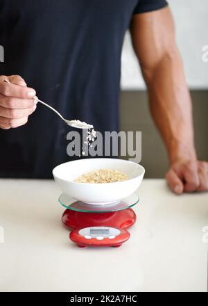 cropped view of man holding measuring cup with blue detergent near washing  machine with dirty Stock Photo by LightFieldStudios