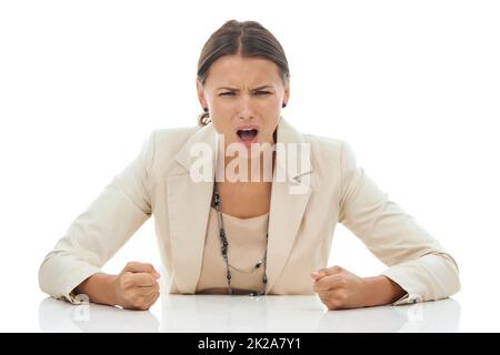 Ive had enough. A young businesswoman slamming her fists down in anger and frustration, isolated on white. Stock Photo