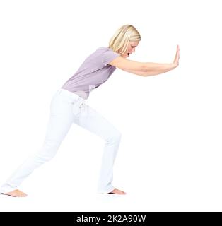 Lets get this out the way. Pretty young woman pushing a obstacle out of the way. Stock Photo