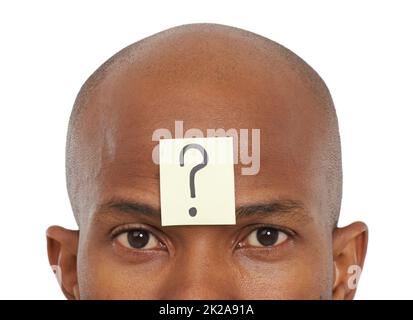 So many unanswered questions.... An African-American man with a question mark stuck to his forehead. Stock Photo