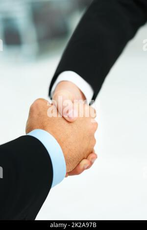 The start of something successful. Cropped shot of two businessmen shaking hands. Stock Photo