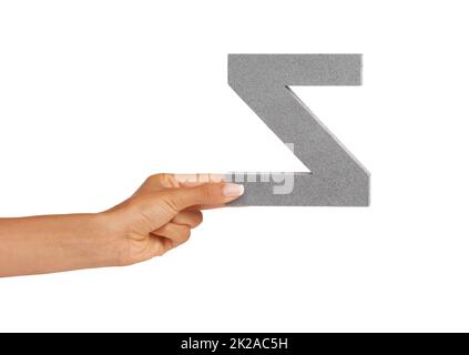 Showing you a letter. A young woman showing a backwards Z letter isolated on white. Stock Photo