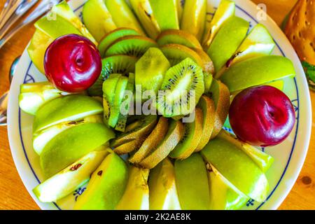 Colorful fruits breakfast food cut and served on a plate. Stock Photo