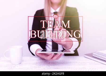 Writing displaying text Team Building. Word for Types of activities used to enhance social relations Presenting Corporate Business Data, Discussing Company Problems Stock Photo