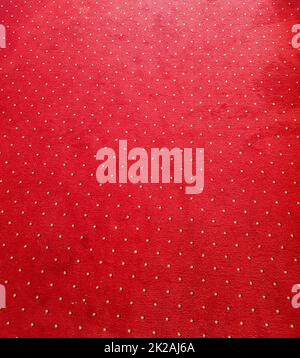 Close-up of the texture of the red carpet on the floor, background Stock Photo