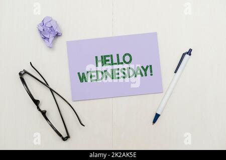 Text sign showing Hello Wednesday. Word Written on it is a good day when you reach in the middle of the week Flashy School Office Supplies, Teaching Learning Collections, Writing Tools Stock Photo