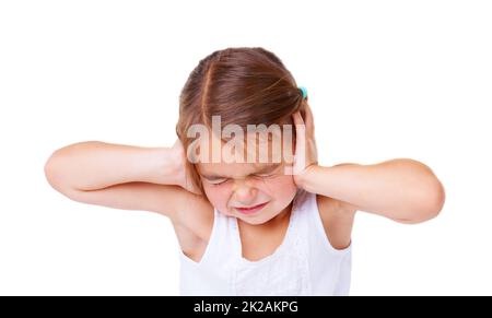 Thats too loud. A little girl covering her ears and closing her eyes. Stock Photo