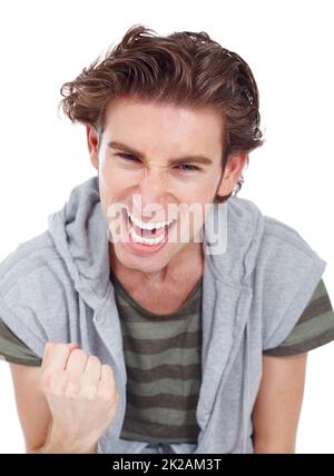 I finally did it. Young man doing a fist pump in an expression of victory. Stock Photo