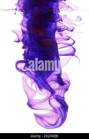 Color me purple. Studio shot of purple ink in water against a white background. Stock Photo