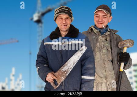 Two bad unskilled builder workers Stock Photo