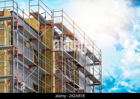 Exterior house wall heat insulation with mineral wool, building under construction Stock Photo