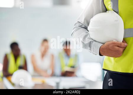 Building, construction and maintenance man employee holding a safety helmet. Construction worker ready to start working with contractor, handyman and Stock Photo