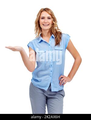 Wholesome beauty endorsing your product - Copyspace. A beautiful woman holding her palm up for you to place your awesome product on. Stock Photo