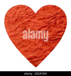 A crumpled red paper heart isolated on a white background. Stock Photo