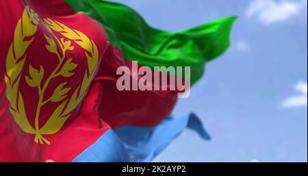 Detail of the national flag of Eritrea waving in the wind on a clear day Stock Photo