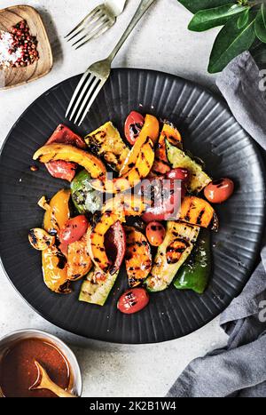 Grilled Butternut Squash,Zucchini ,Pepper with Harissa sauce Stock Photo