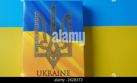 Ukraine flag and coat of arms. Golden trident on cloth flag. National symbol. Blue-yellow flag of Ukraine. Stock Photo