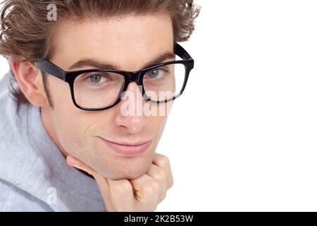 Smooth and suave. Handsome young man posing with his chin resting on his hand. Stock Photo