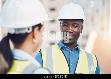 Logistics worker, engineer or construction builder working on industrial site, building architecture in partnership and team doing maintenance Stock Photo